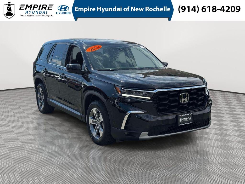 2024 Honda Pilot EX-L 7 Passenger in Crystal Black Pearl — front three-quarter view