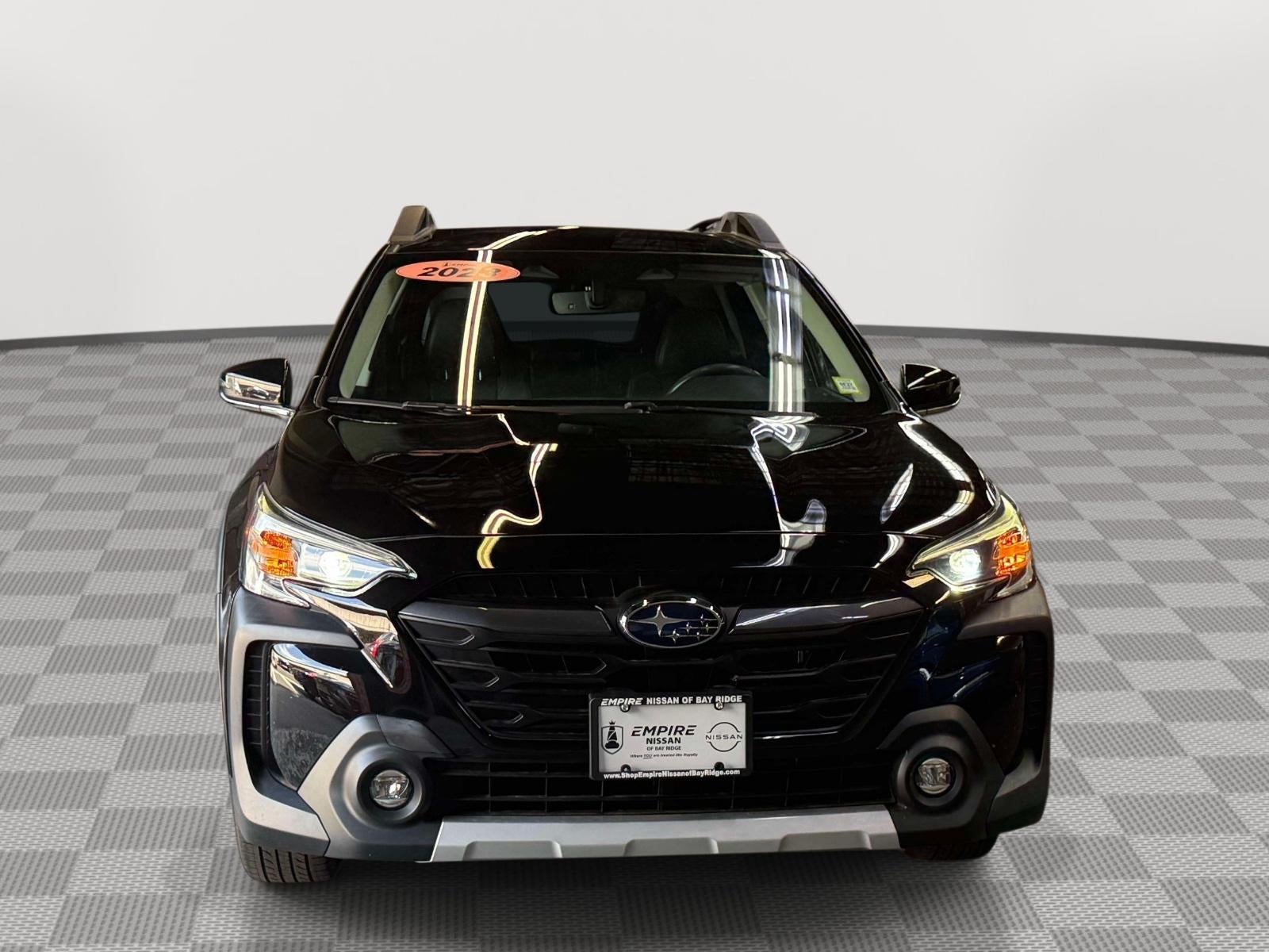 2023 Subaru Outback Limited in Crystal Black Silica — front three-quarter view