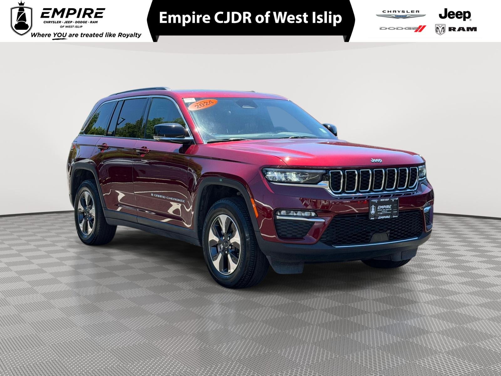 2024 Jeep Grand Cherokee 4xe 4xe in Velvet Red Pearlcoat — front three-quarter view