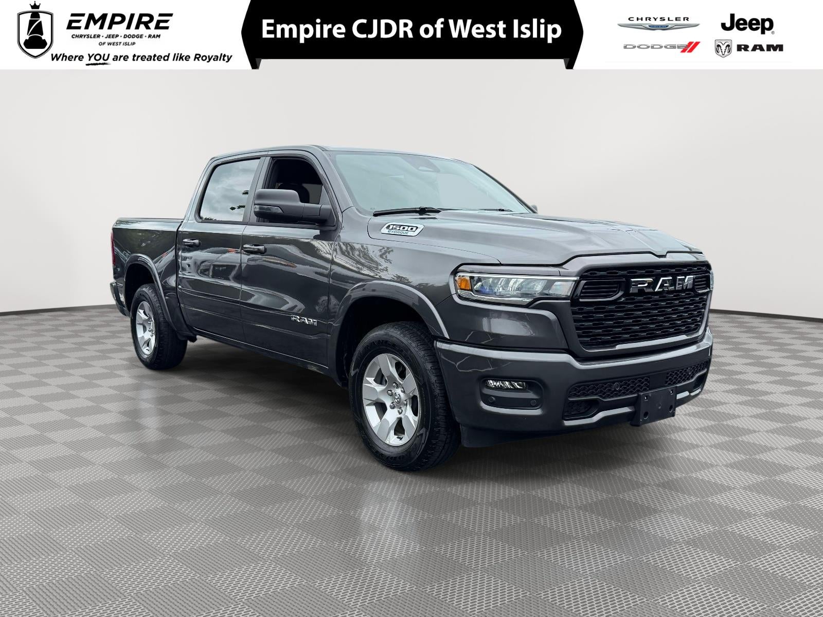 2025 RAM 1500 Big Horn Crew Cab 4x4 5'7' Box in Granite Crystal Metallic Clearcoat — front three-quarter view