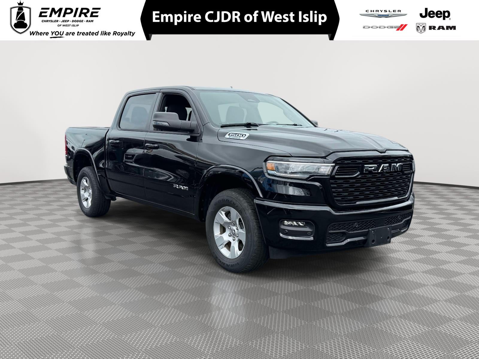 2025 RAM 1500 Big Horn Crew Cab 4x4 5'7' Box in Diamond Black Crystal Pearlcoat — front three-quarter view