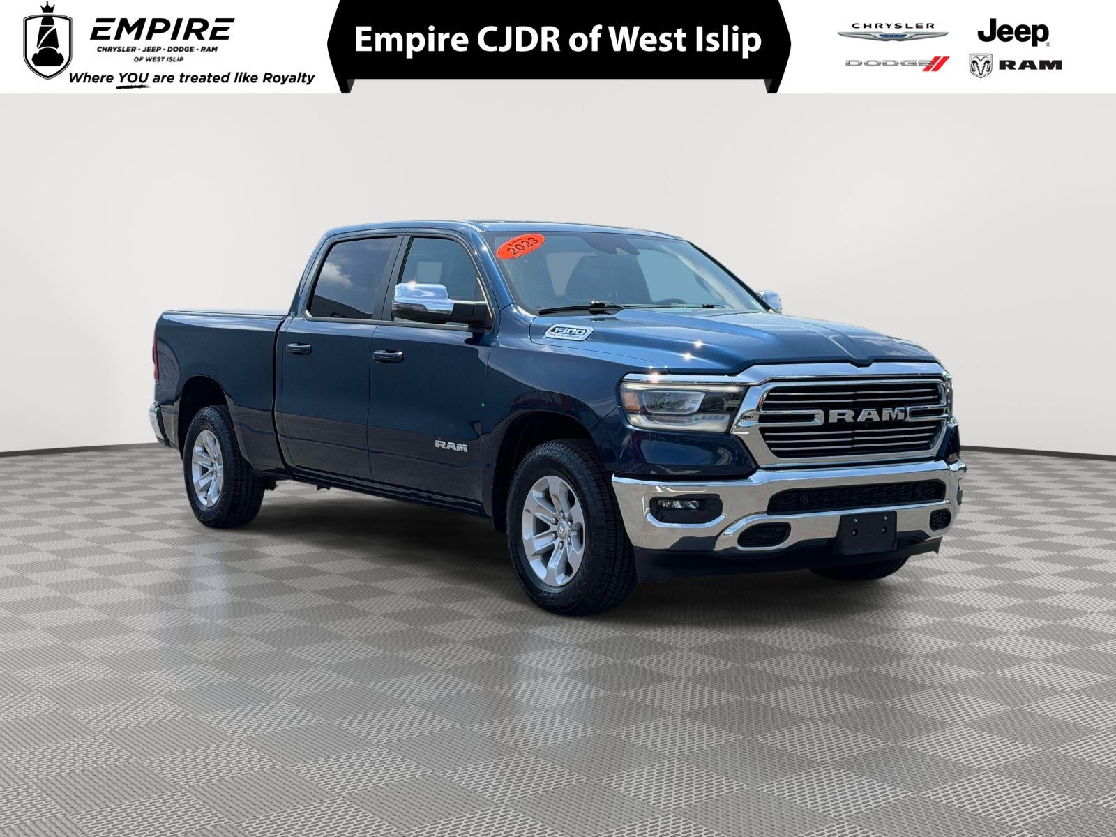 2023 RAM 1500 Laramie Crew Cab 4x4 6'4' Box in Patriot Blue Pearlcoat — front three-quarter view