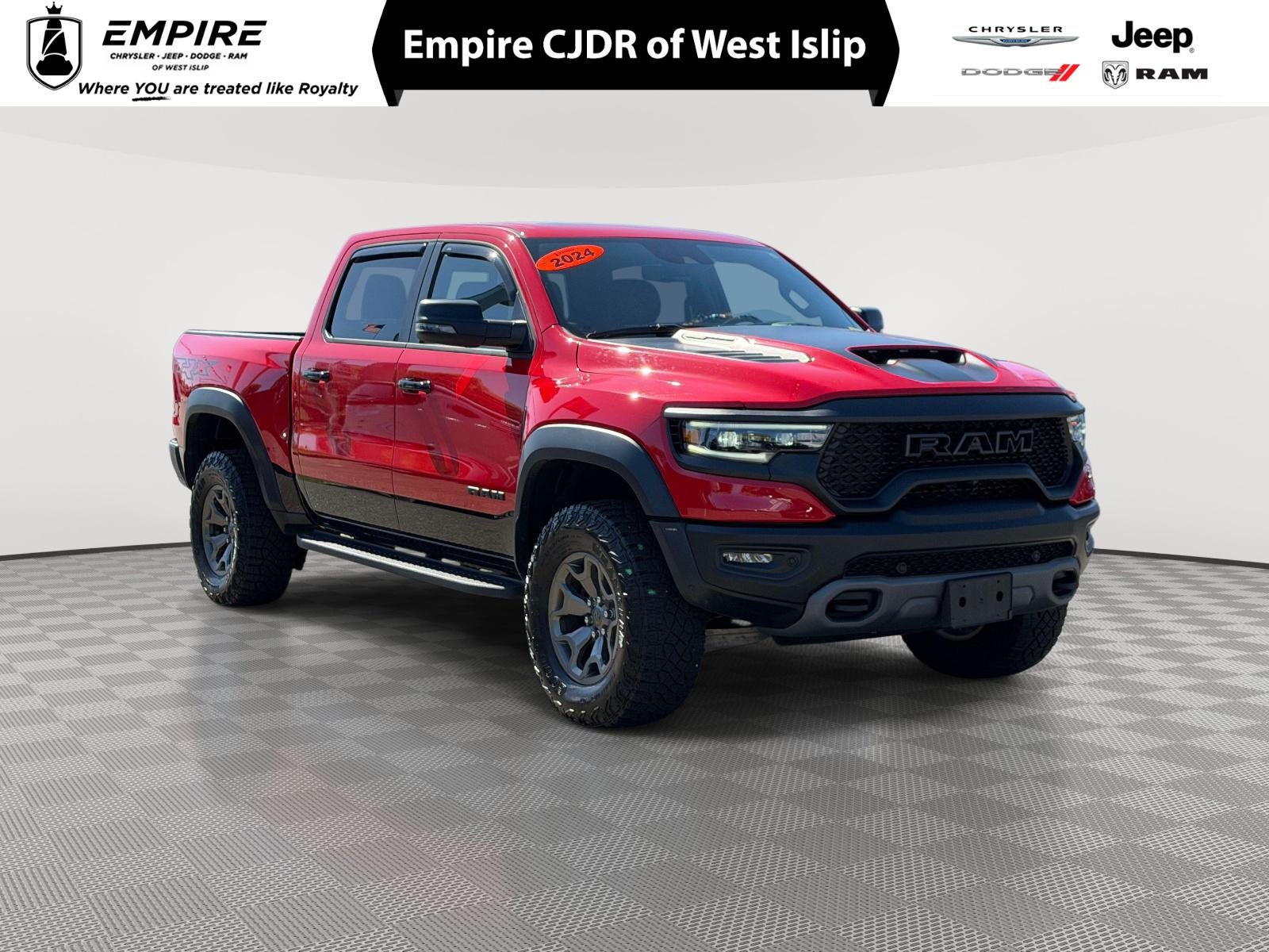 2024 RAM 1500 TRX Crew Cab 4x4 5'7' Box in Flame Red Clearcoat — front three-quarter view