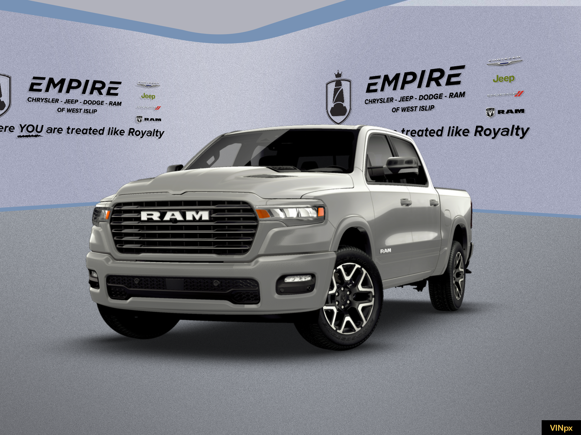 2026 RAM Ram 1500 RAM 1500 LARAMIE CREW CAB 4X4 5'7' BOX in Silver Zynith Exterior Paint — front three-quarter view