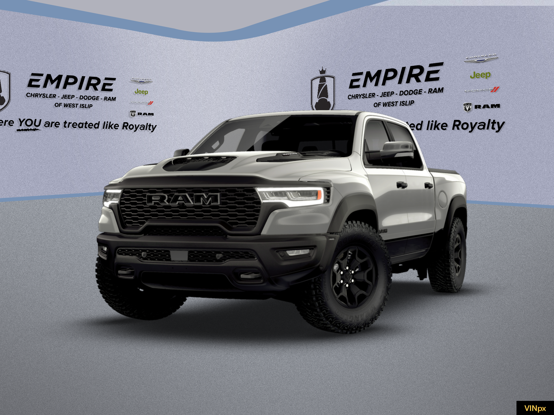 2026 RAM Ram 1500 RAM 1500 RHO CREW CAB 4X4 5'7' BOX in Silver Zynith Exterior Paint — front three-quarter view
