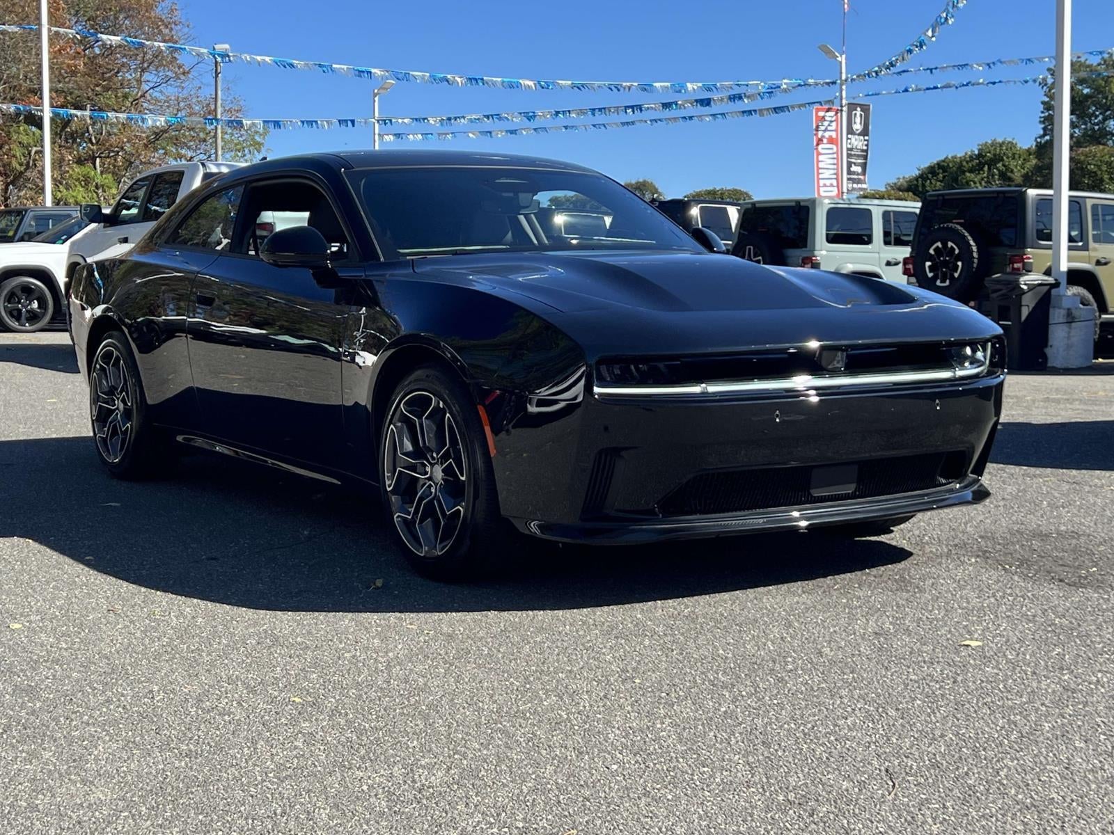 2024 Dodge Charger CHARGER DAYTONA R/T AWD in Diamond Black Crystal Pearlcoat — front three-quarter view