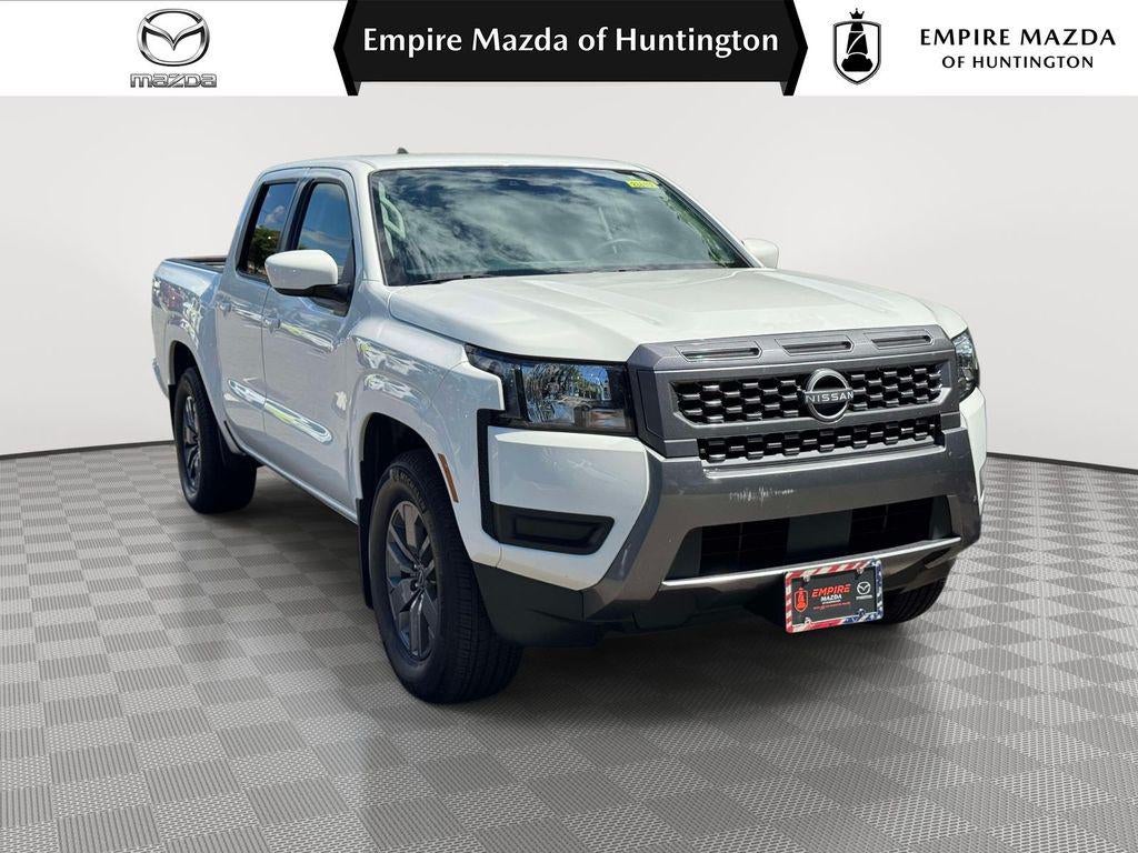 2025 Nissan Frontier Crew Cab SV 4x2 in Glacier White — front three-quarter view