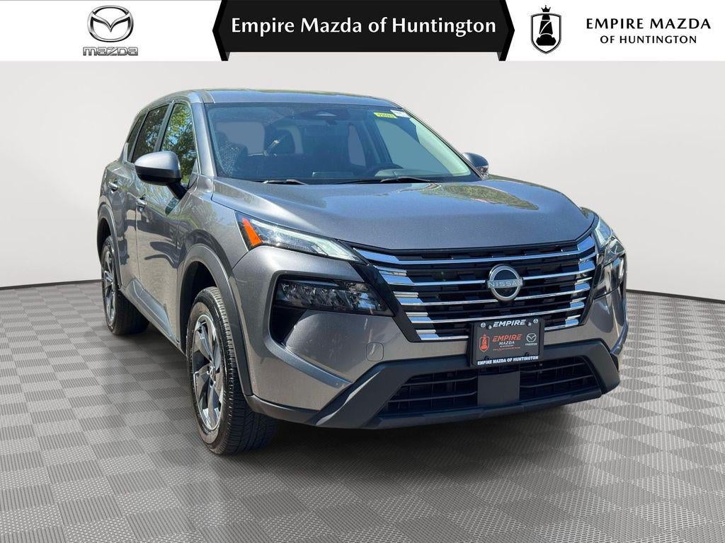 2024 Nissan Rogue SV Intelligent AWD in Gun Metallic — front three-quarter view